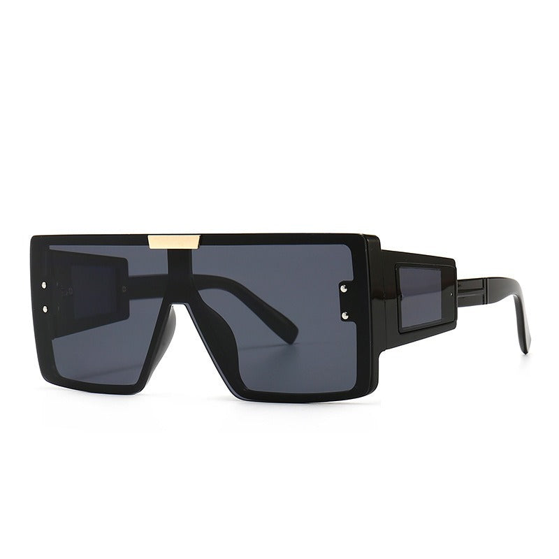 Large frame sunglasses with widened legs and patch sunglasses
